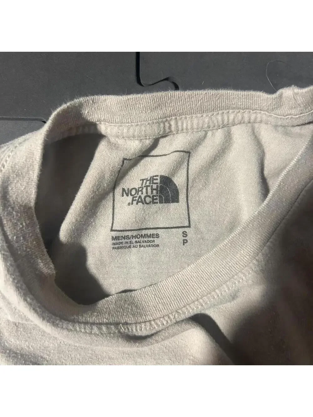 Men’s cream Northface T-shirt. Size small.